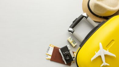 flat lay yellow luggage with copy space