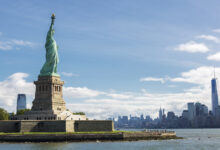 statue of liberty and the new york city skyline usa