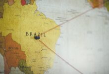 closeup shot of a black pin on the brazil country on the map